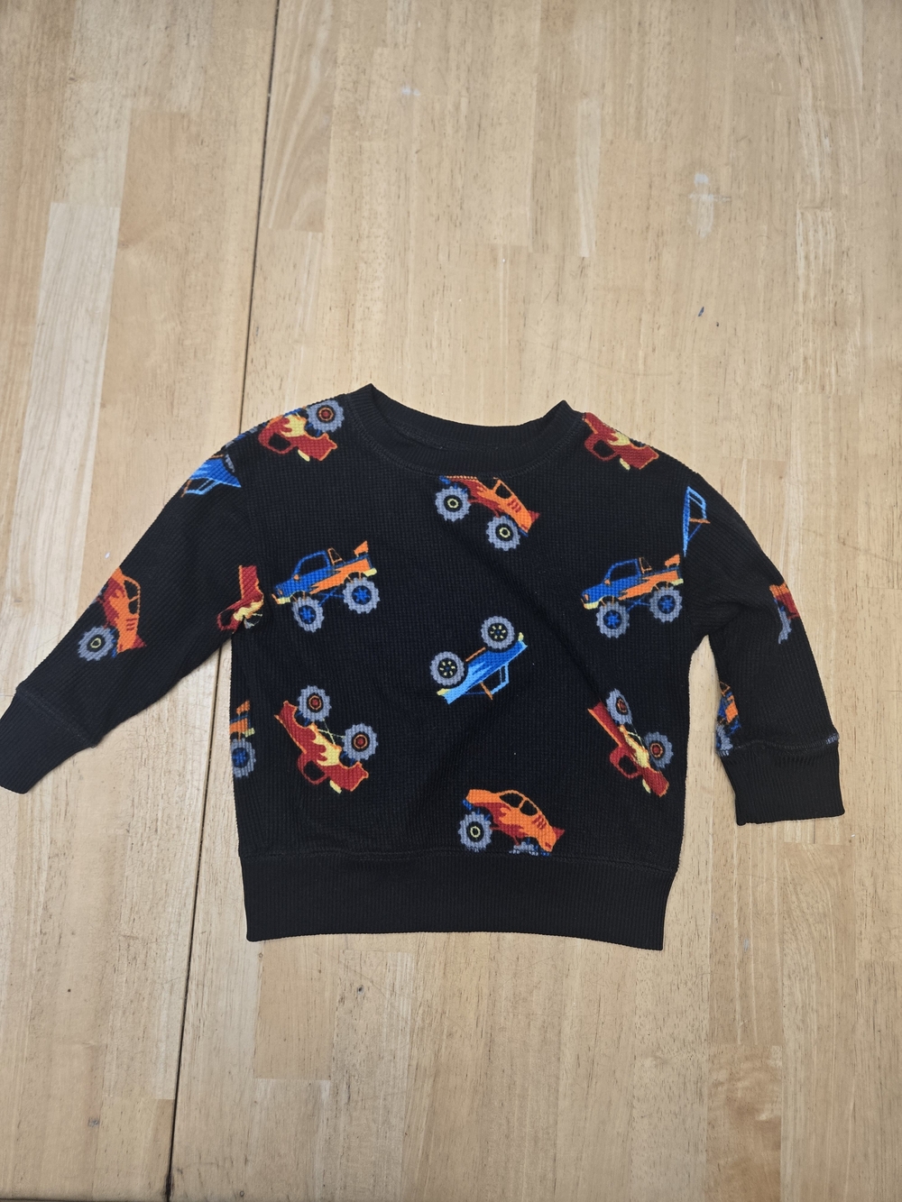 jumping beans Black Sweatshirt with Red, Orange and Blue Monster Trucks